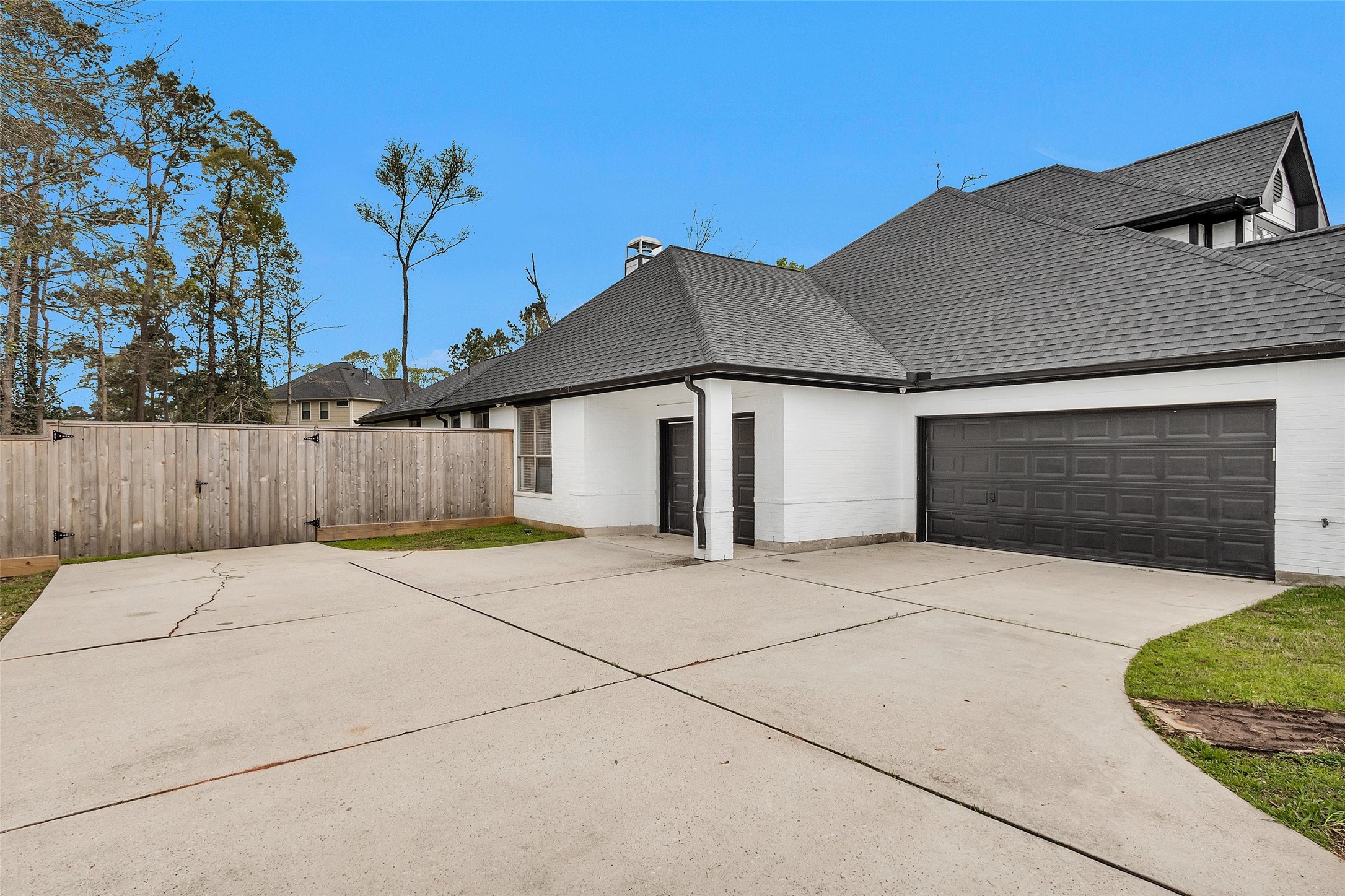 10004 Summer Ridge Lane Conroe, TX 77302 - Photo 4 of 50 a front view of a house with a garage