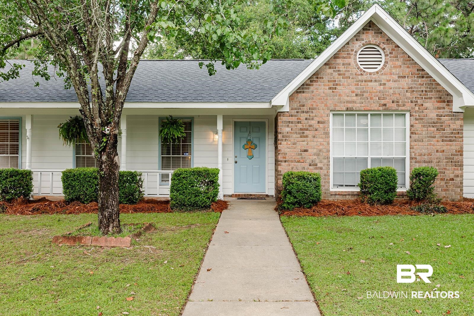 2920 Quail Creek Run Mobile, AL 36695 - Photo 2 of 33 Ranch-style house featuring roof with shingles, a front yard, brick siding, and covered porch