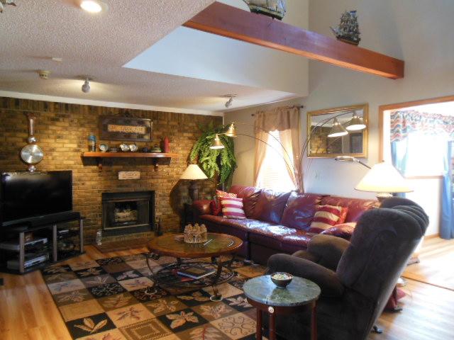 180 Batson Road Cunningham, TN 37052 - Photo 4 of 20 GREATROOM W/ VAULTED CEILING, EXPOSED BEAMS & MASONRY FIREPLACE