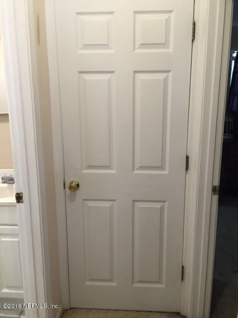 10235 Shark Road West Jacksonville, FL 32226 - Photo 17 of 40 a view of wooden door