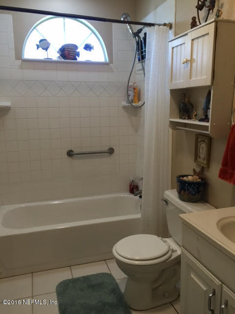10235 Shark Road West Jacksonville, FL 32226 - Photo 10 of 40 a bathroom with a toilet and a shower