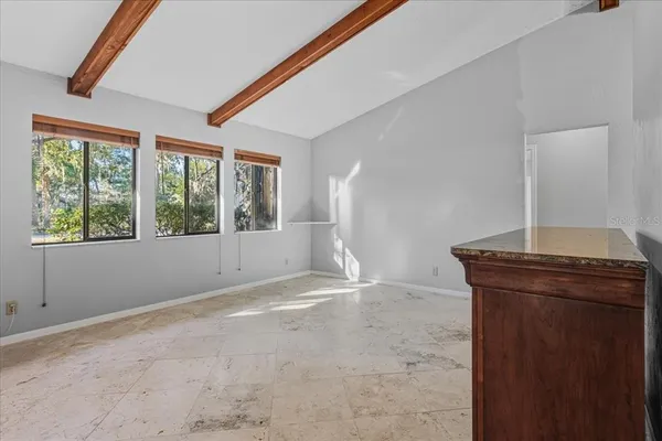 a spacious bathroom with double sink and a mirror