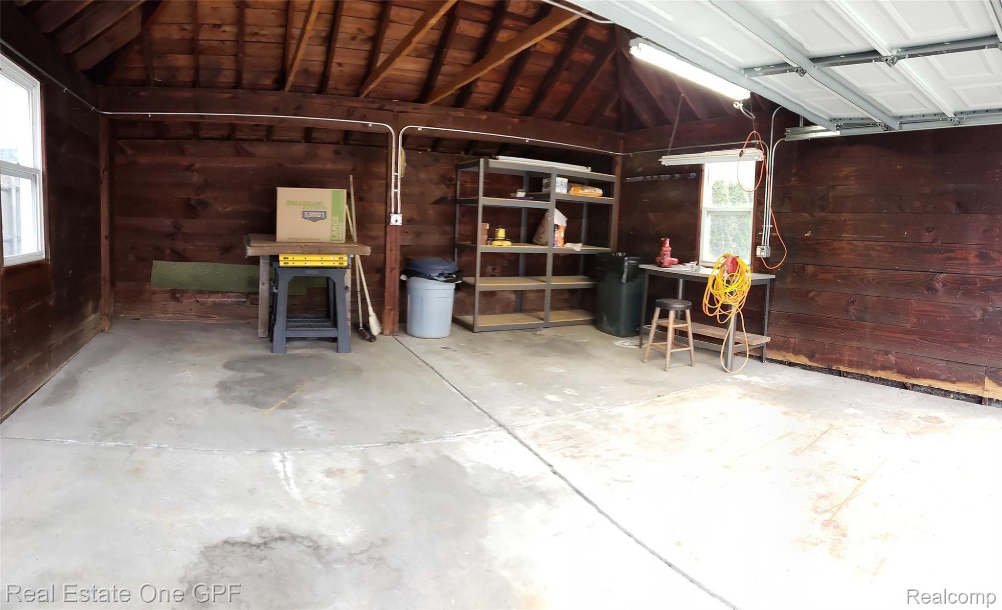 1210 Yorkshire Road Grosse Pointe, MI 48230 - Photo 31 of 37 Deep 2 car garage with hip roof and wooden interior walls.