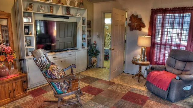 a view of a lobby with furniture and lamp
