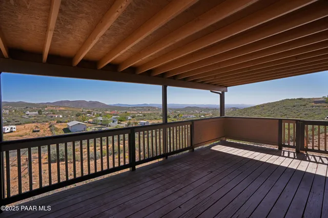 a view of a balcony with wooden floor