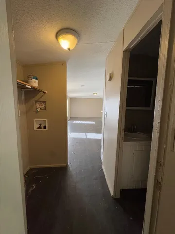 a view of hallway with wooden floor