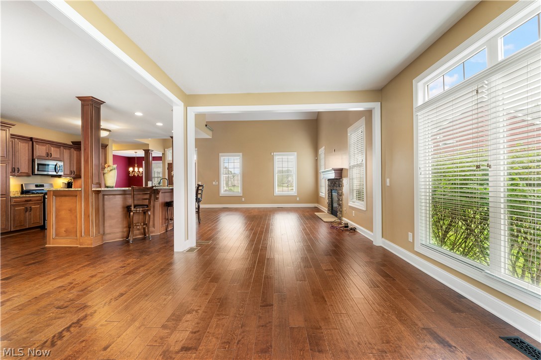 3356 Huntcliffe Road Northeast Canton, OH 44721 - Photo 24 of 50 Living room featuring a wealth of natural light and dark wood-type flooring