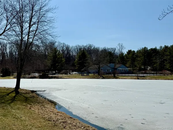 a view of swimming pool with an outdoor space and seating area