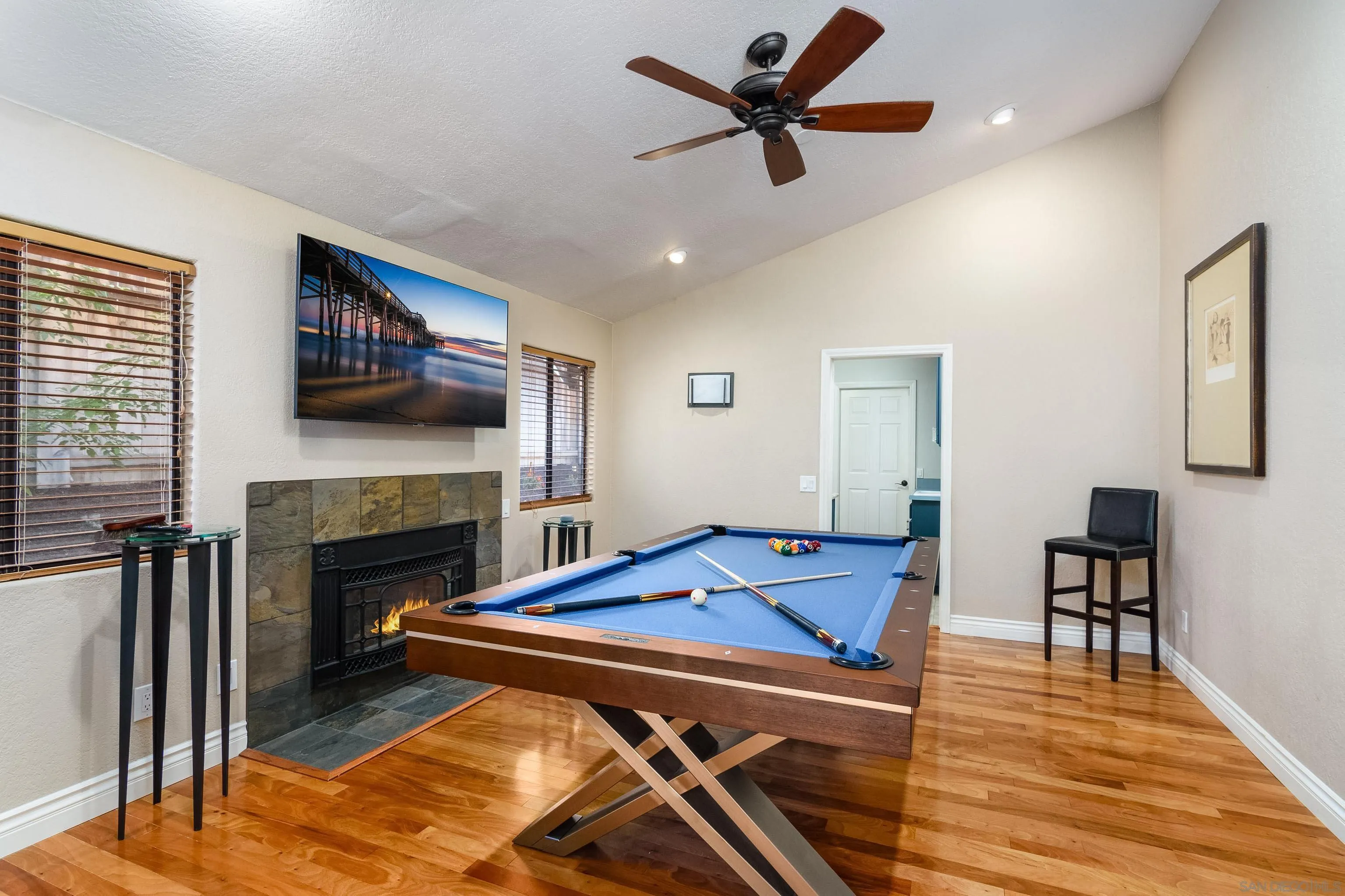 23949 Barona Mesa Road Ramona, CA 92065 - Photo 11 of 35 a living room with furniture pool table and a fireplace