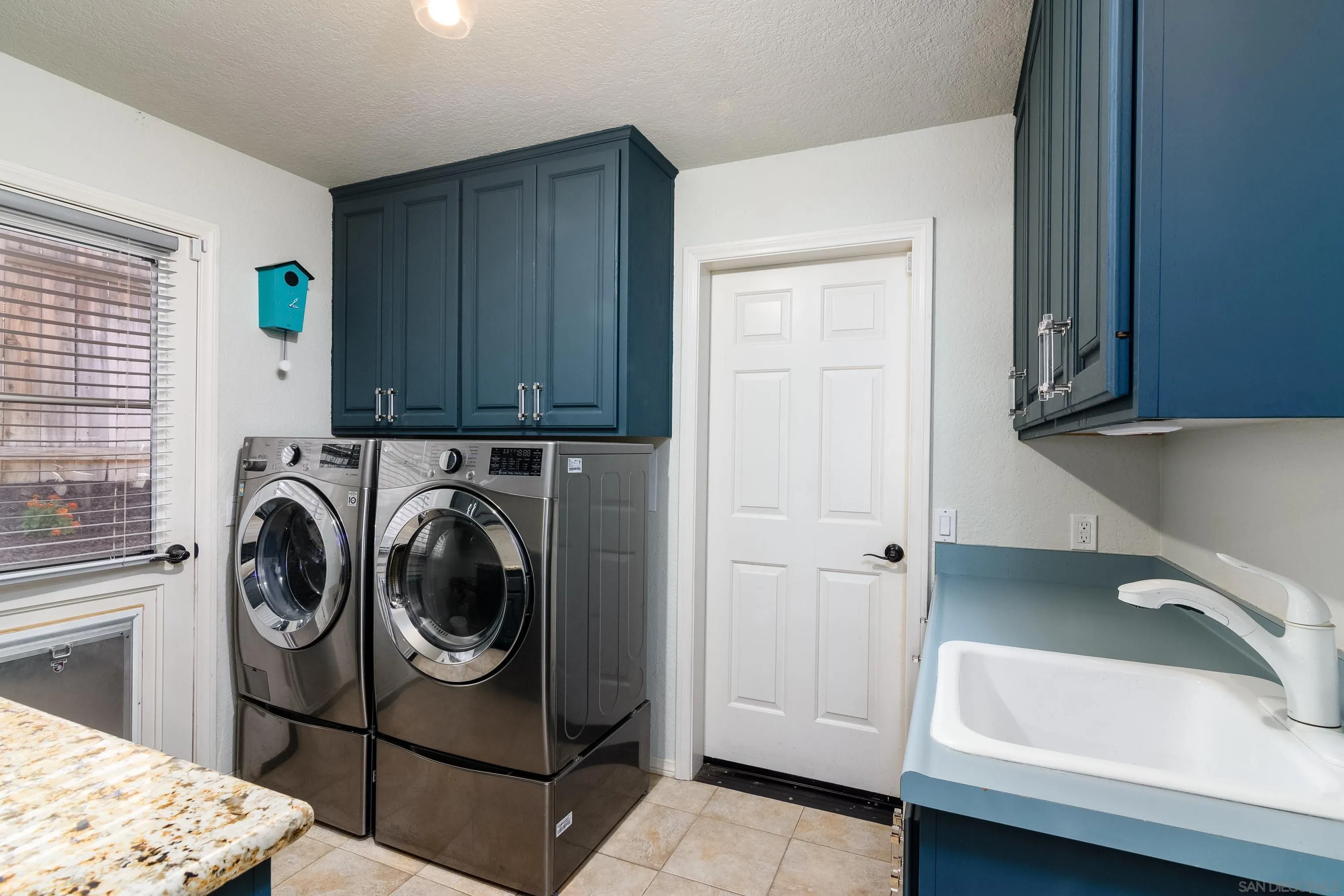 23949 Barona Mesa Road Ramona, CA 92065 - Photo 12 of 35 a utility room with sink dryer and washer