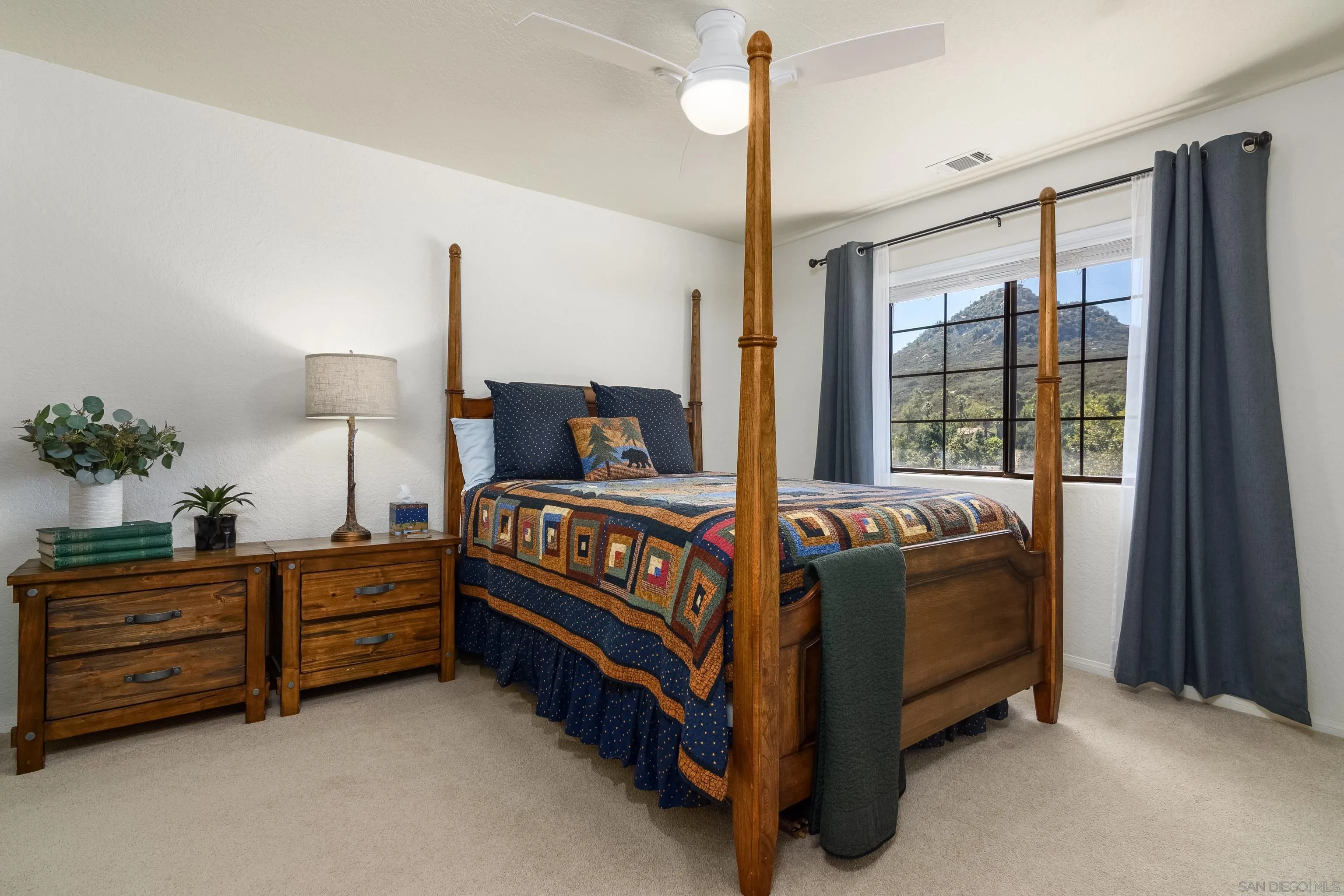 23949 Barona Mesa Road Ramona, CA 92065 - Photo 20 of 35 a bed sitting in a bedroom next to a window