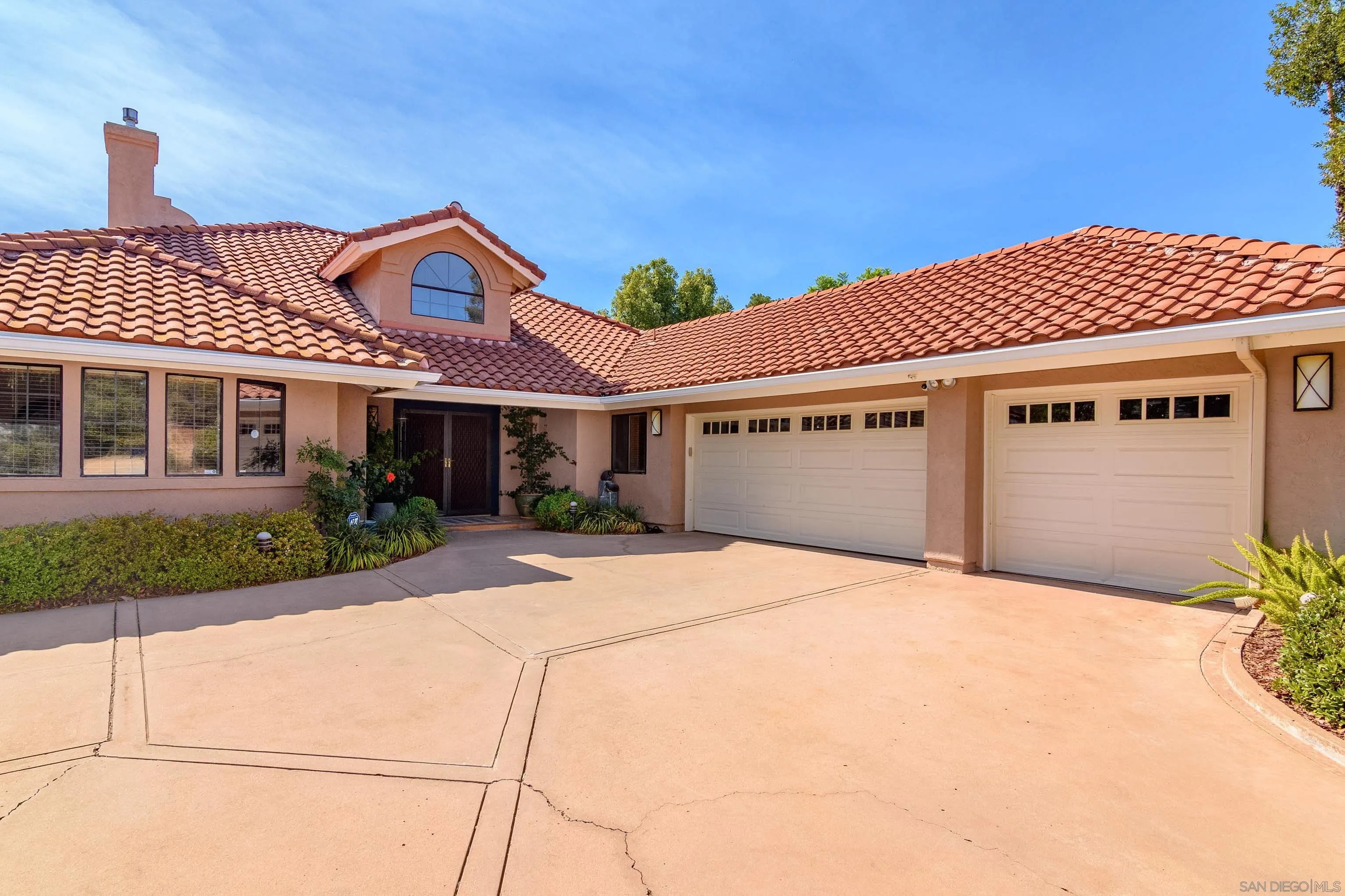 23949 Barona Mesa Road Ramona, CA 92065 - Photo 2 of 35 a front view of a house with a garden