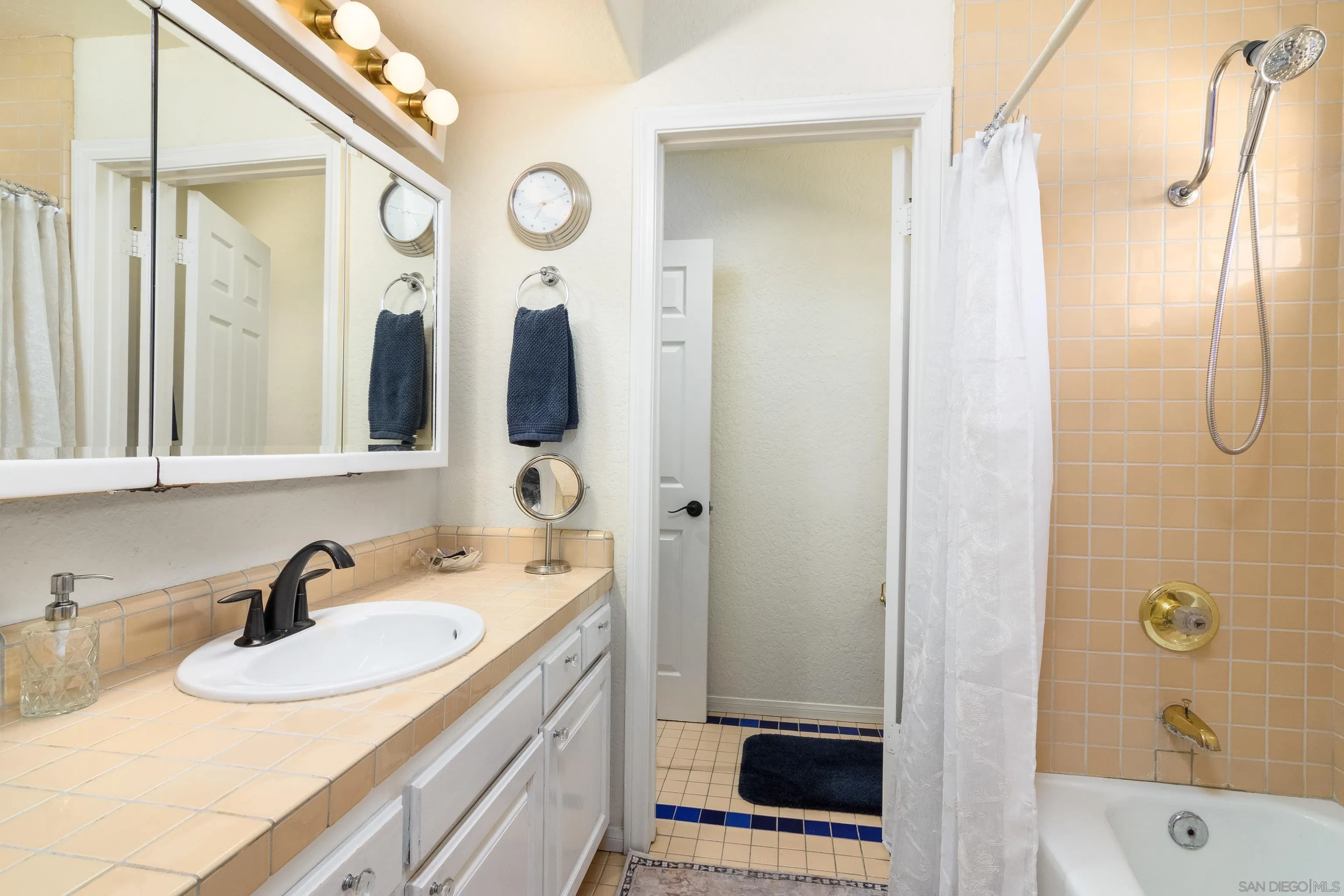 23949 Barona Mesa Road Ramona, CA 92065 - Photo 23 of 35 a bathroom with a sink and a mirror