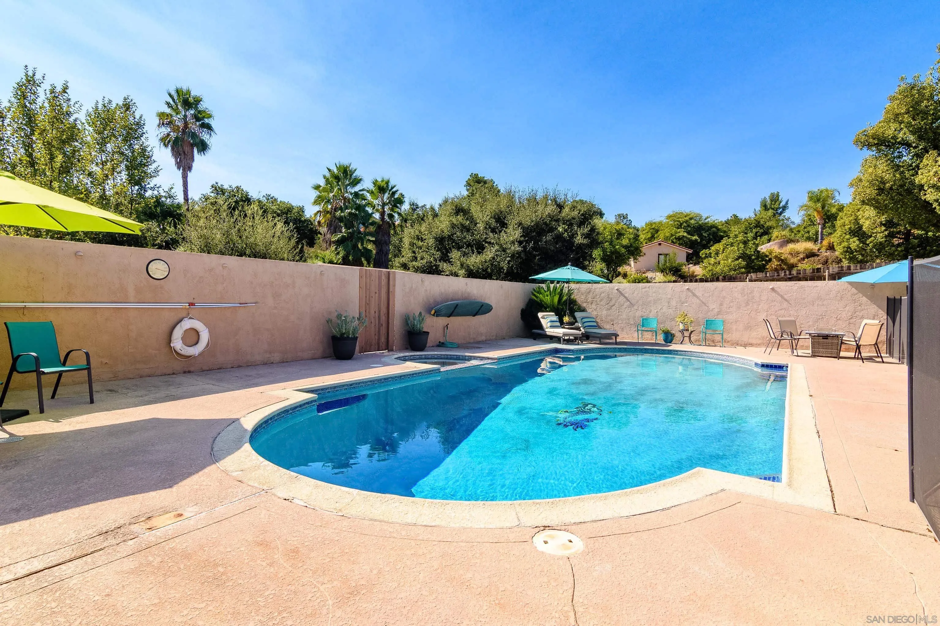 23949 Barona Mesa Road Ramona, CA 92065 - Photo 29 of 35 a view of a swimming pool with a yard