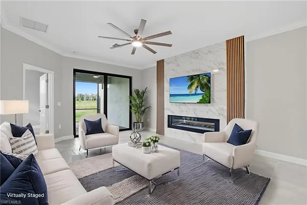 a living room with furniture and a large window