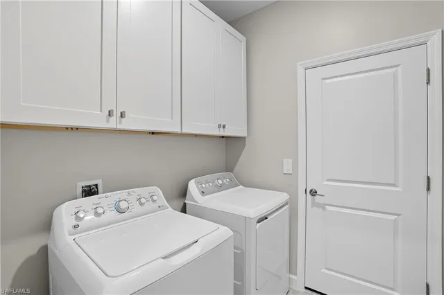 a view of storage and utility room with washer and dryer