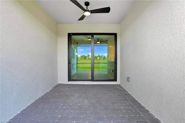 a view of an empty room with a sliding door