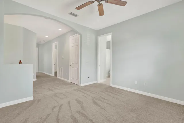 an empty room with fan