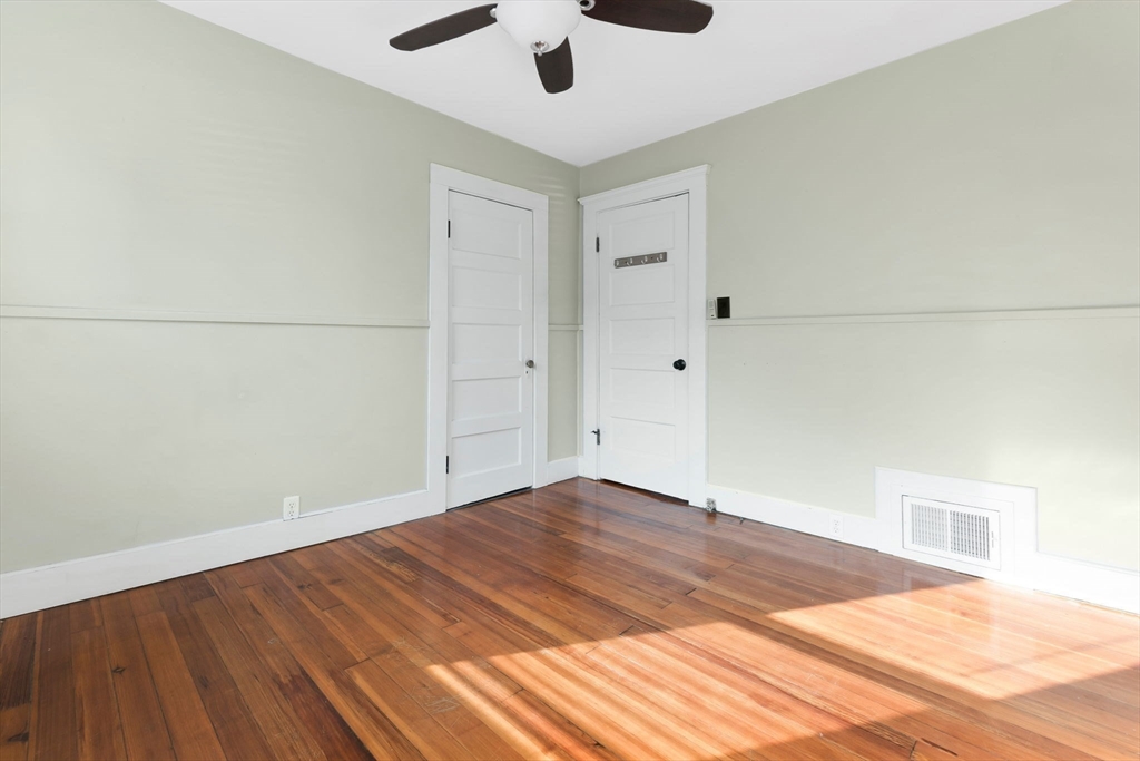 21 Goodell Street, Unit 1 Salem, MA 01970 - Photo 14 of 19 a view of empty room with wooden floor