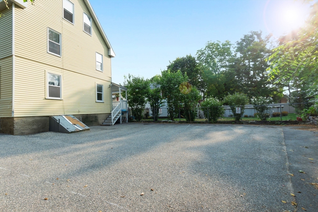 21 Goodell Street, Unit 1 Salem, MA 01970 - Photo 17 of 19 a view of a house with a backyard