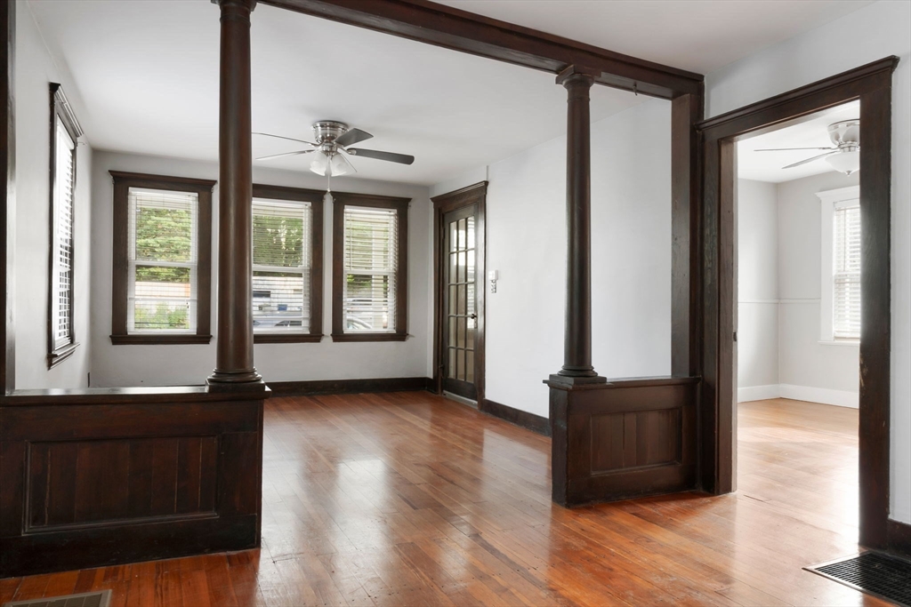 21 Goodell Street, Unit 1 Salem, MA 01970 - Photo 6 of 19 a view of front door with wooden floor and windows
