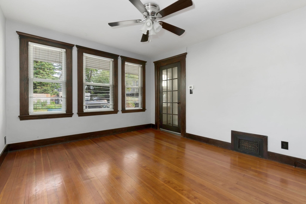 21 Goodell Street, Unit 1 Salem, MA 01970 - Photo 7 of 19 a view of an empty room with window and wooden floor
