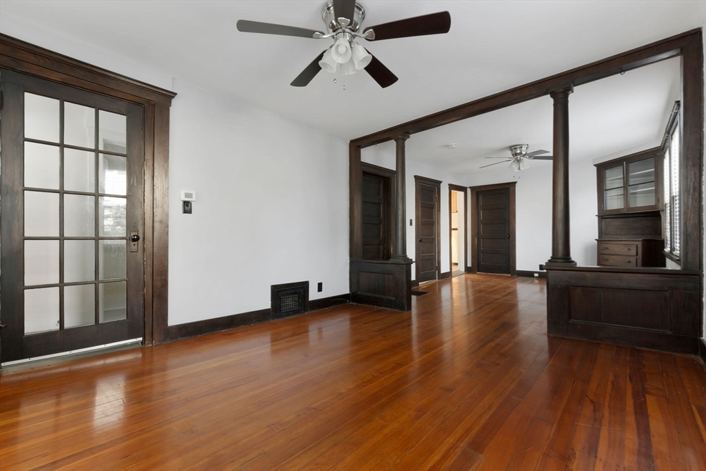 21 Goodell Street, Unit 1 Salem, MA 01970 - Photo 8 of 19 a view of an empty room with wooden floor and a window
