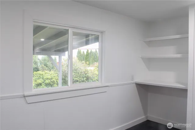 a view of an empty room with a window