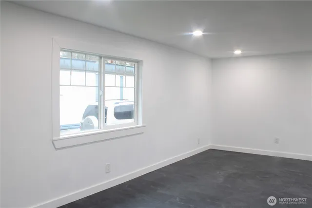 a view of an empty room with a window