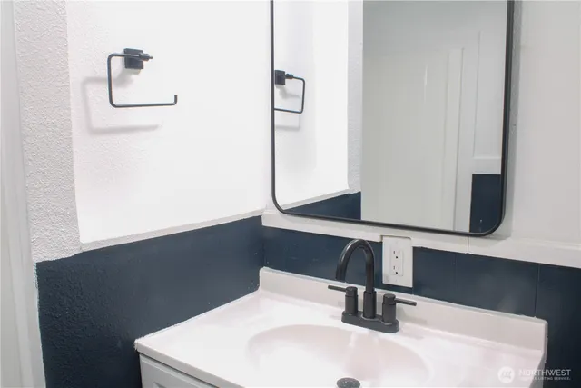 a white toilet sitting in a bathroom