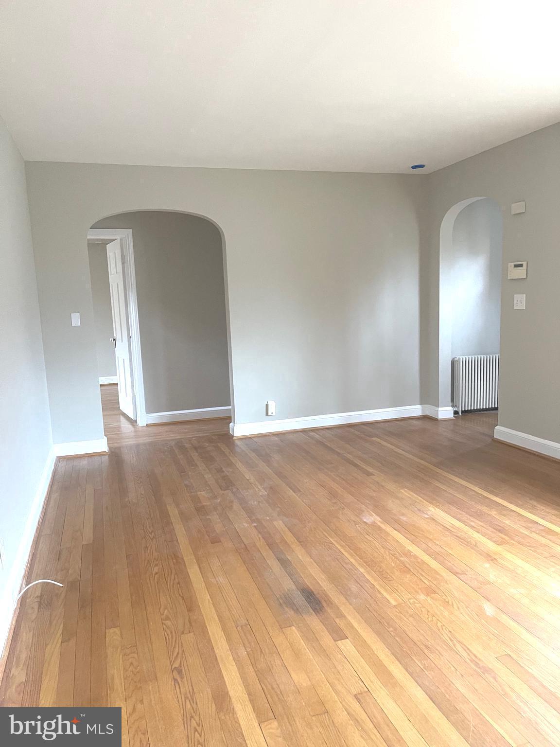 9803 Forest Grove Drive Silver Spring, MD 20902 - Photo 5 of 24 a view of a livingroom with wooden floor