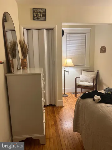 a bed room with furniture and a window