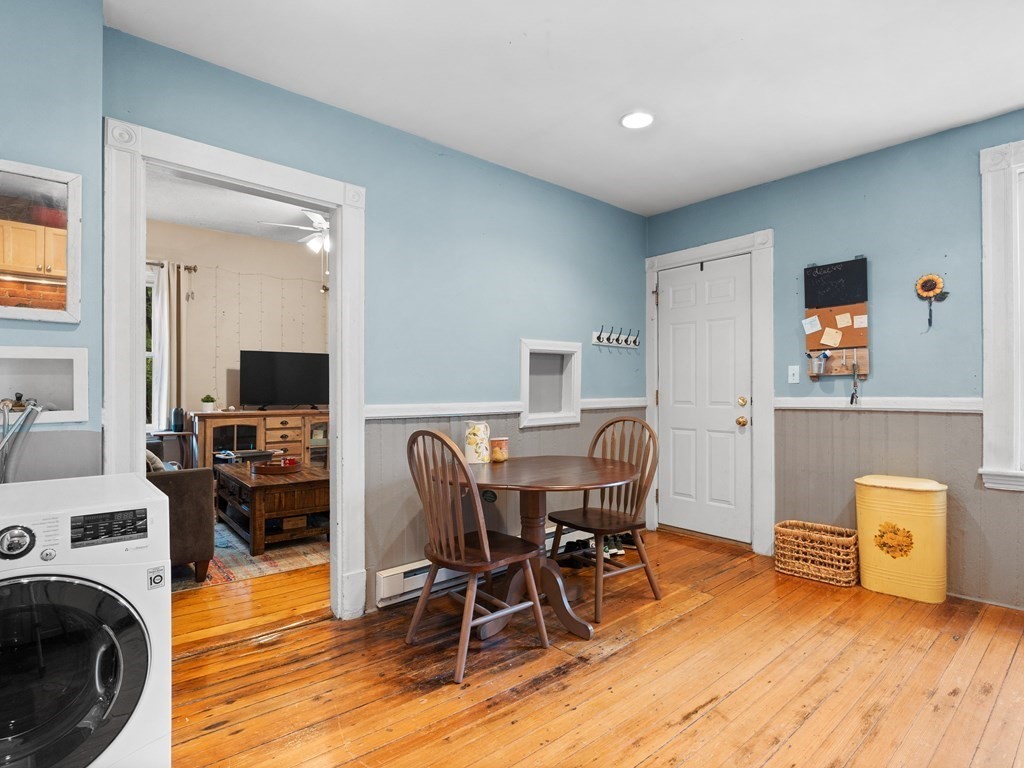 427-435 Faneuil Street, Unit R4 Boston, MA 02135 - Photo 11 of 18 a workspace with furniture and wooden floor