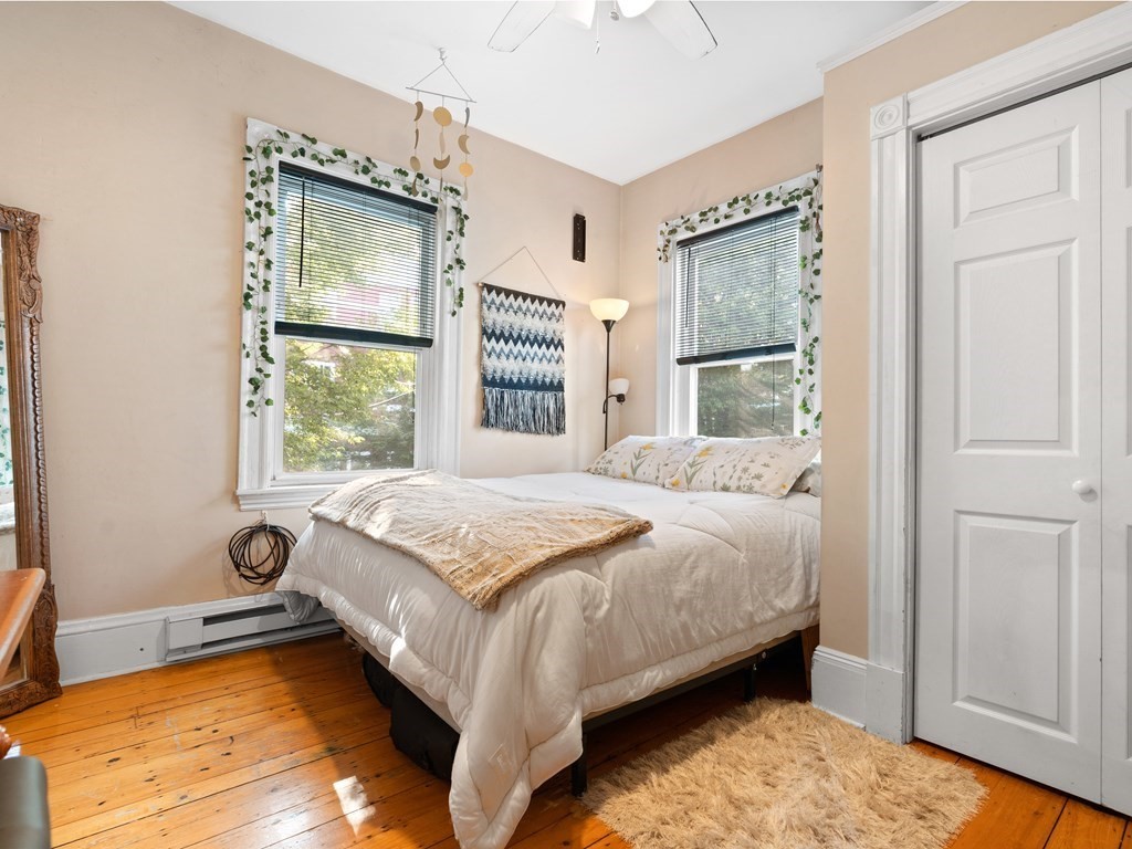 427-435 Faneuil Street, Unit R4 Boston, MA 02135 - Photo 5 of 18 a bedroom with a bed and a window