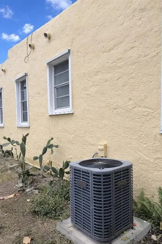 a view of a brick house with many windows