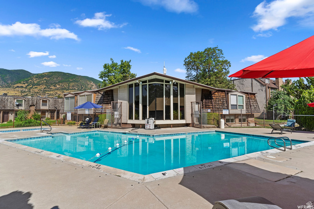 88 West 50 South, Unit J10 Centerville, UT 84014 - Photo 18 of 19 Geometric swimming pool with concrete surround