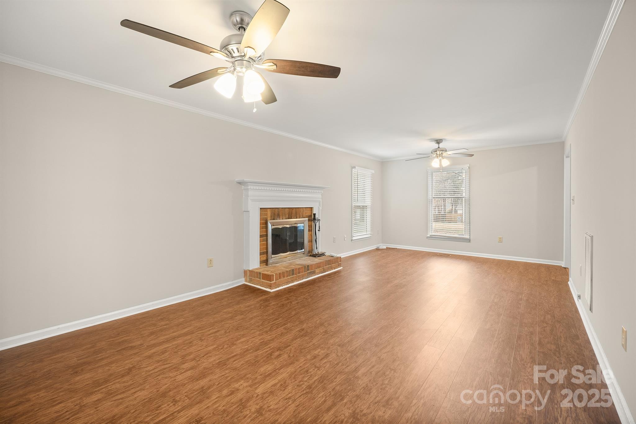 8730 Rittenhouse Circle Charlotte, NC 28270 - Photo 12 of 48 a view of an empty room with window and wooden floor