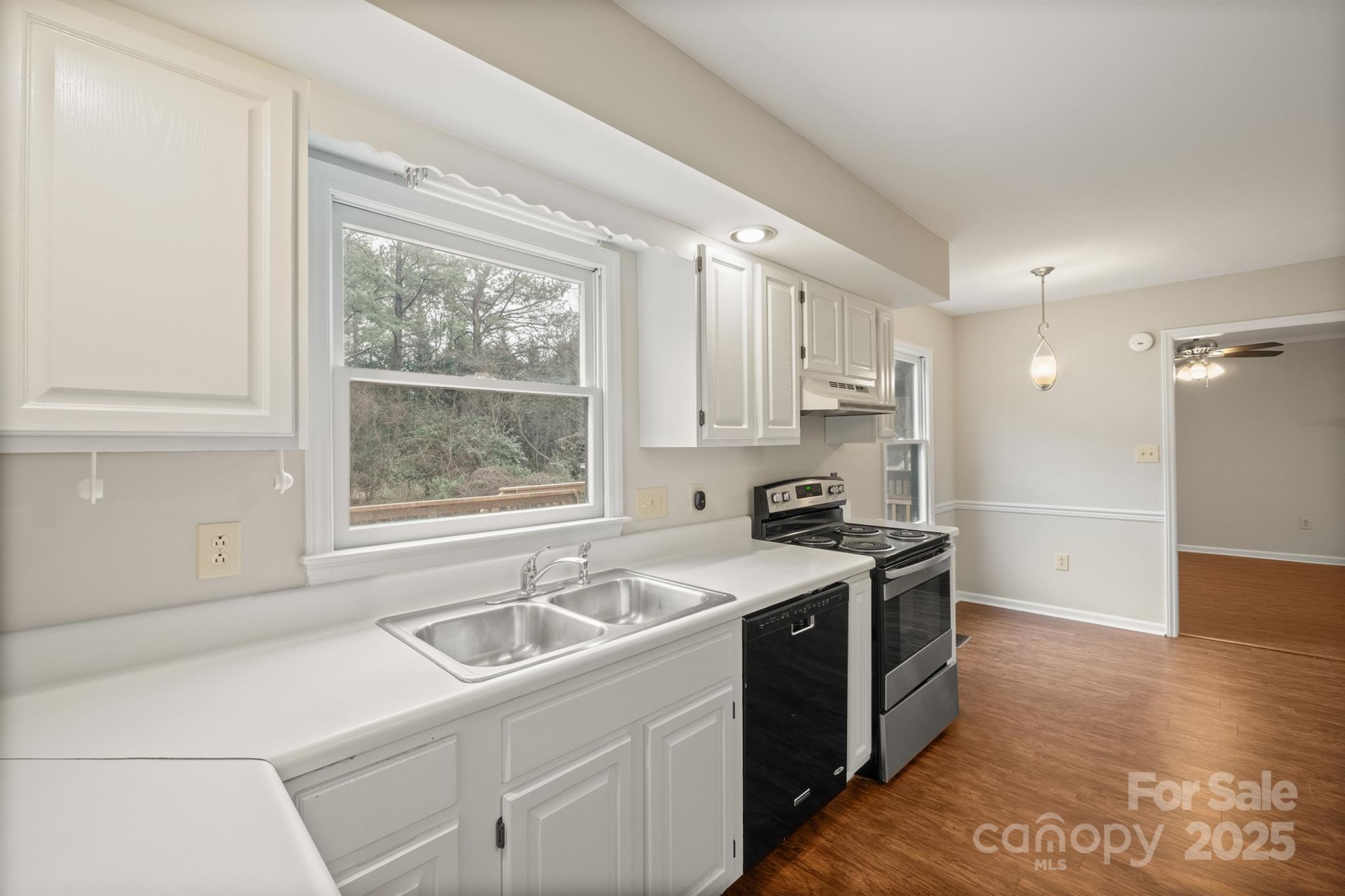 8730 Rittenhouse Circle Charlotte, NC 28270 - Photo 16 of 48 a kitchen with a sink stove top oven and refrigerator