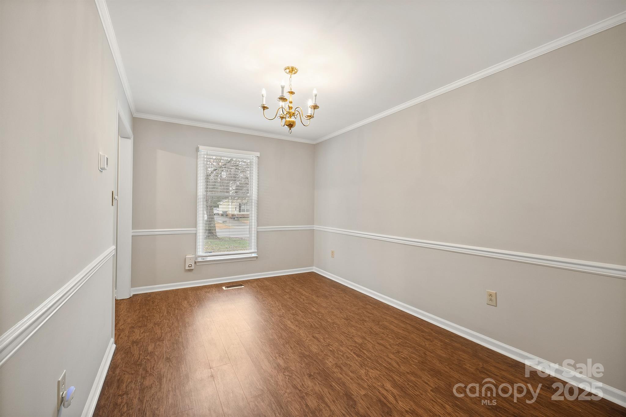 8730 Rittenhouse Circle Charlotte, NC 28270 - Photo 22 of 48 an empty room with wooden floor and windows