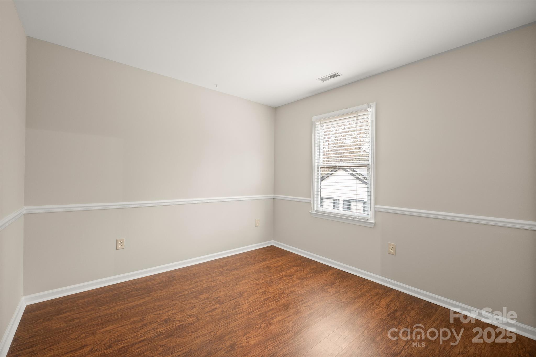 8730 Rittenhouse Circle Charlotte, NC 28270 - Photo 25 of 48 an empty room with wooden floor and windows