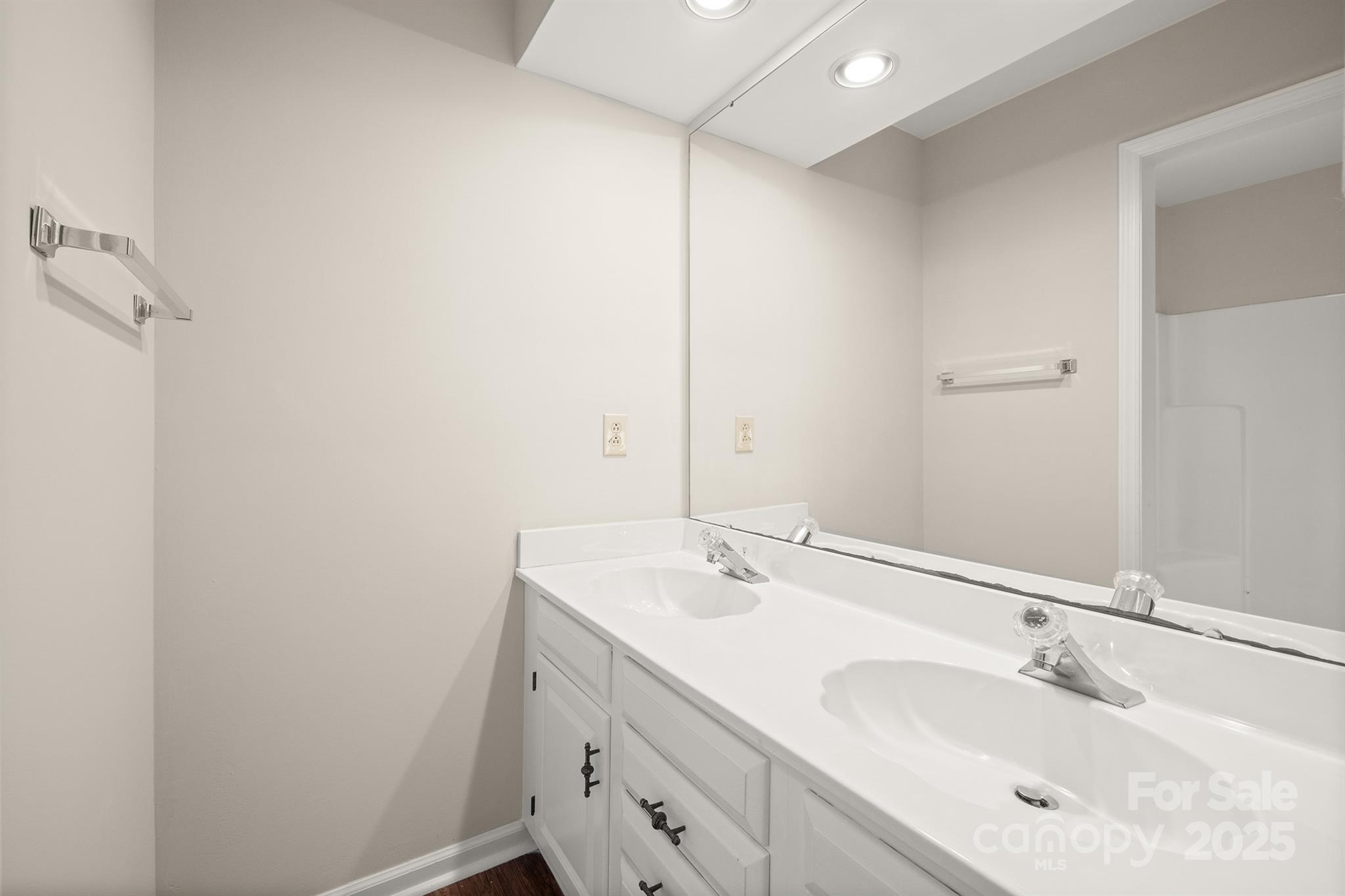 8730 Rittenhouse Circle Charlotte, NC 28270 - Photo 31 of 48 a bathroom with a sink and a mirror