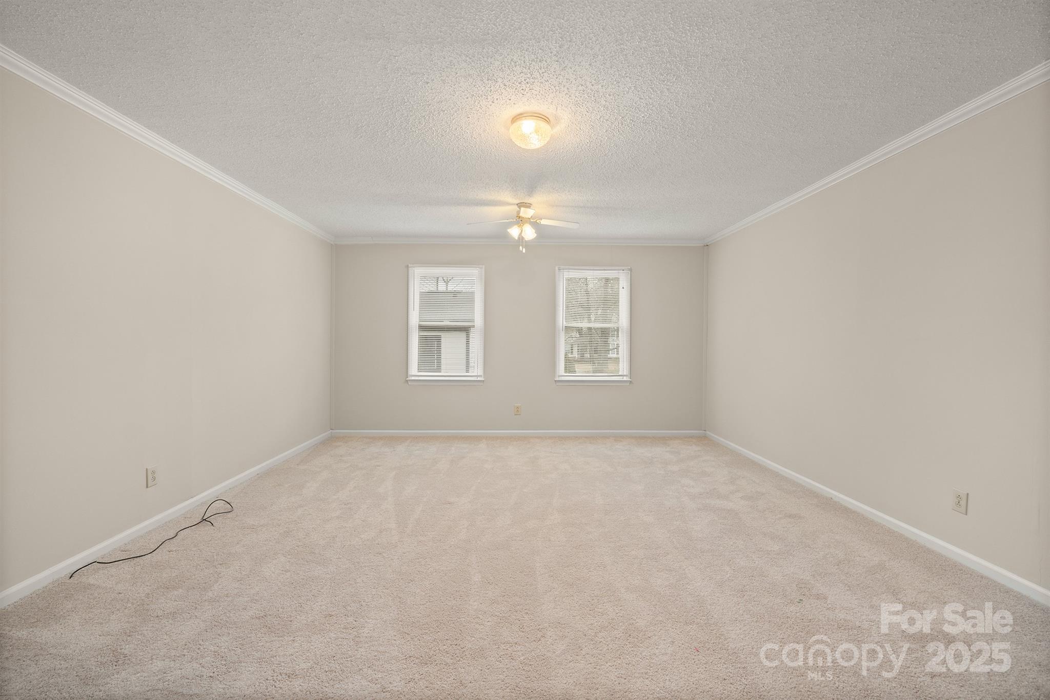 8730 Rittenhouse Circle Charlotte, NC 28270 - Photo 40 of 48 an empty room with windows and fan