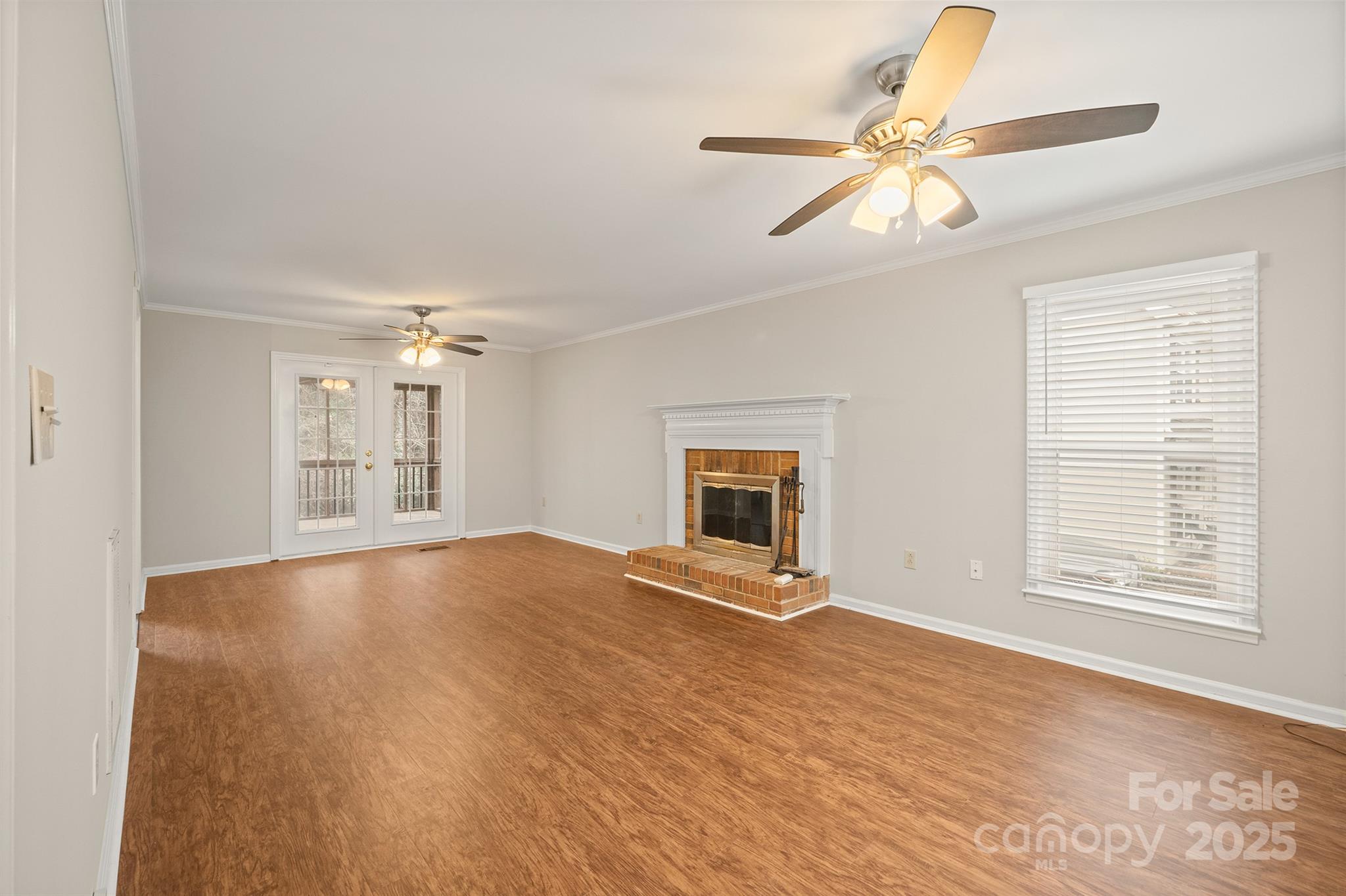 8730 Rittenhouse Circle Charlotte, NC 28270 - Photo 10 of 48 a view of an empty room with a window and wooden floor