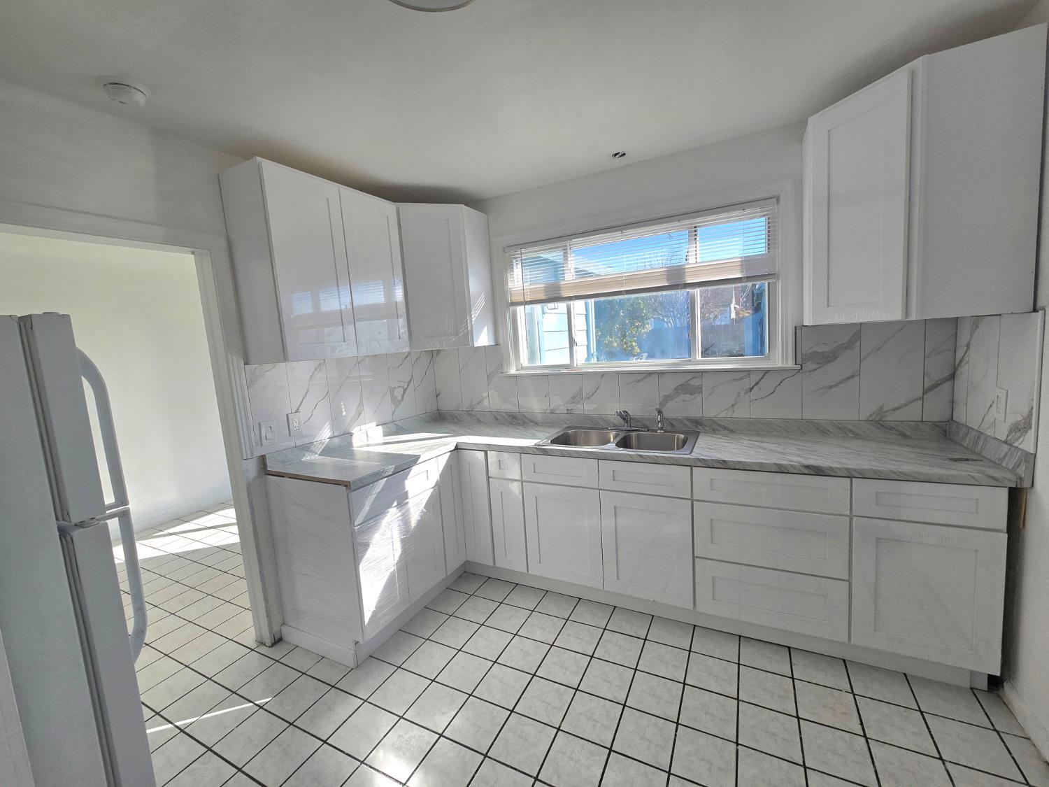 320 North Sanborn Road Salinas, CA 93905 - Photo 14 of 27 a kitchen with cabinets and window