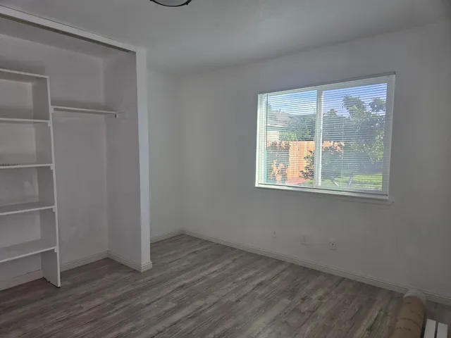 wooden floor and window in an empty room