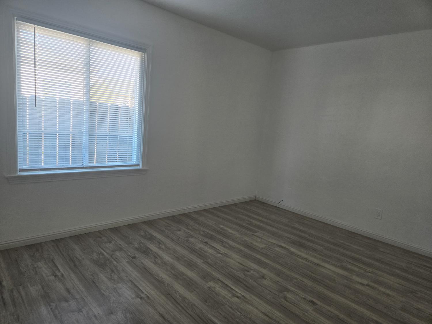 320 North Sanborn Road Salinas, CA 93905 - Photo 21 of 27 wooden floor and window in an empty room