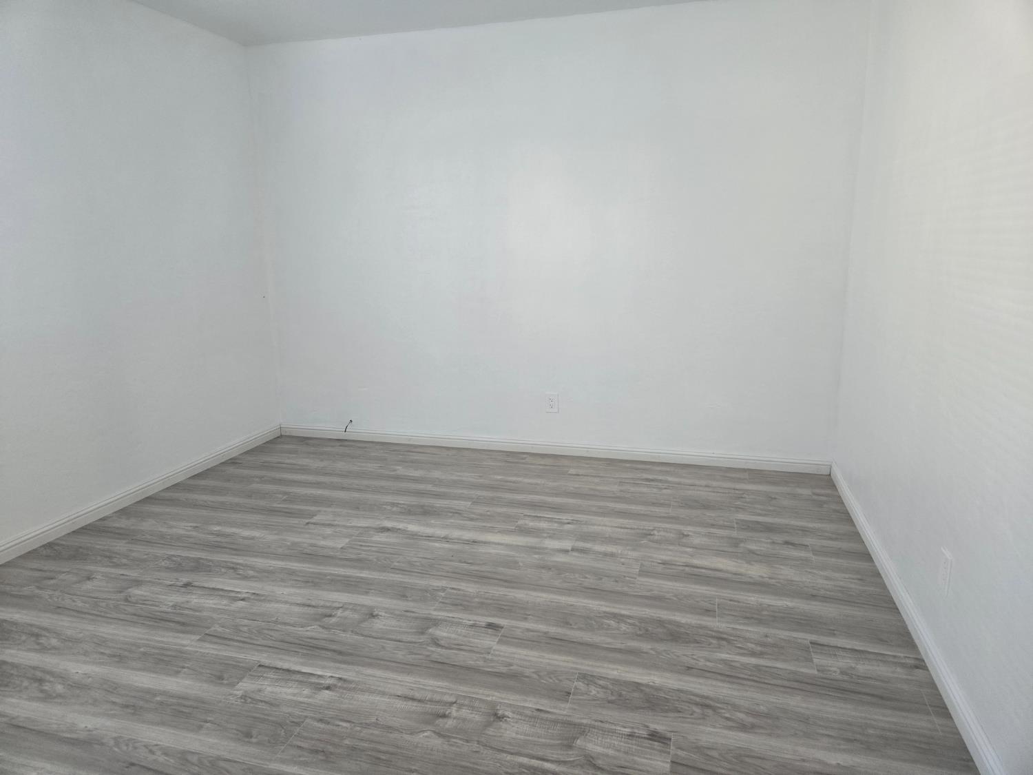 320 North Sanborn Road Salinas, CA 93905 - Photo 22 of 27 a view of an empty room with wooden floor