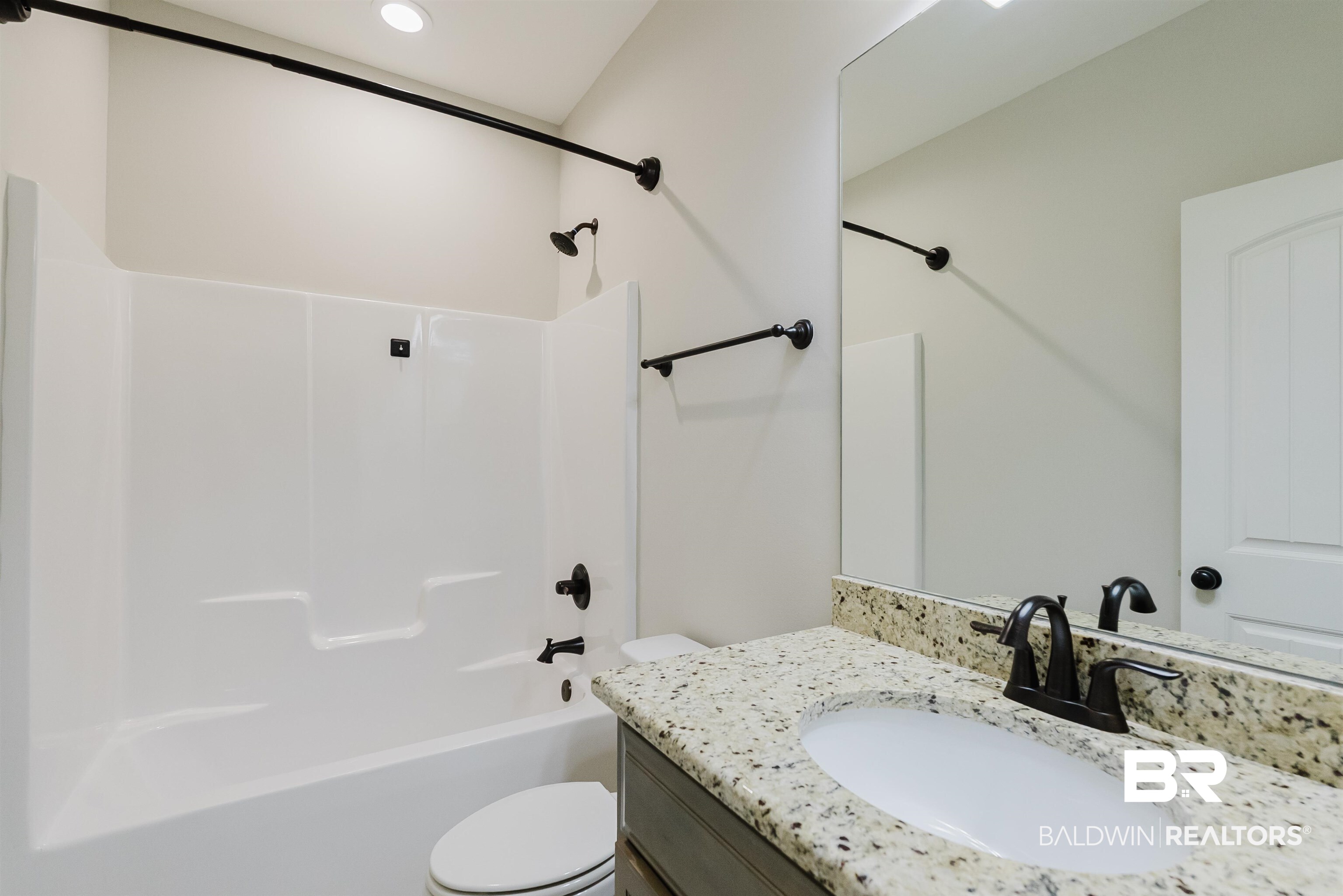 237 Hawthorne Circle Fairhope, AL 36532 - Photo 12 of 14 Full bathroom featuring vanity and washtub / shower combination