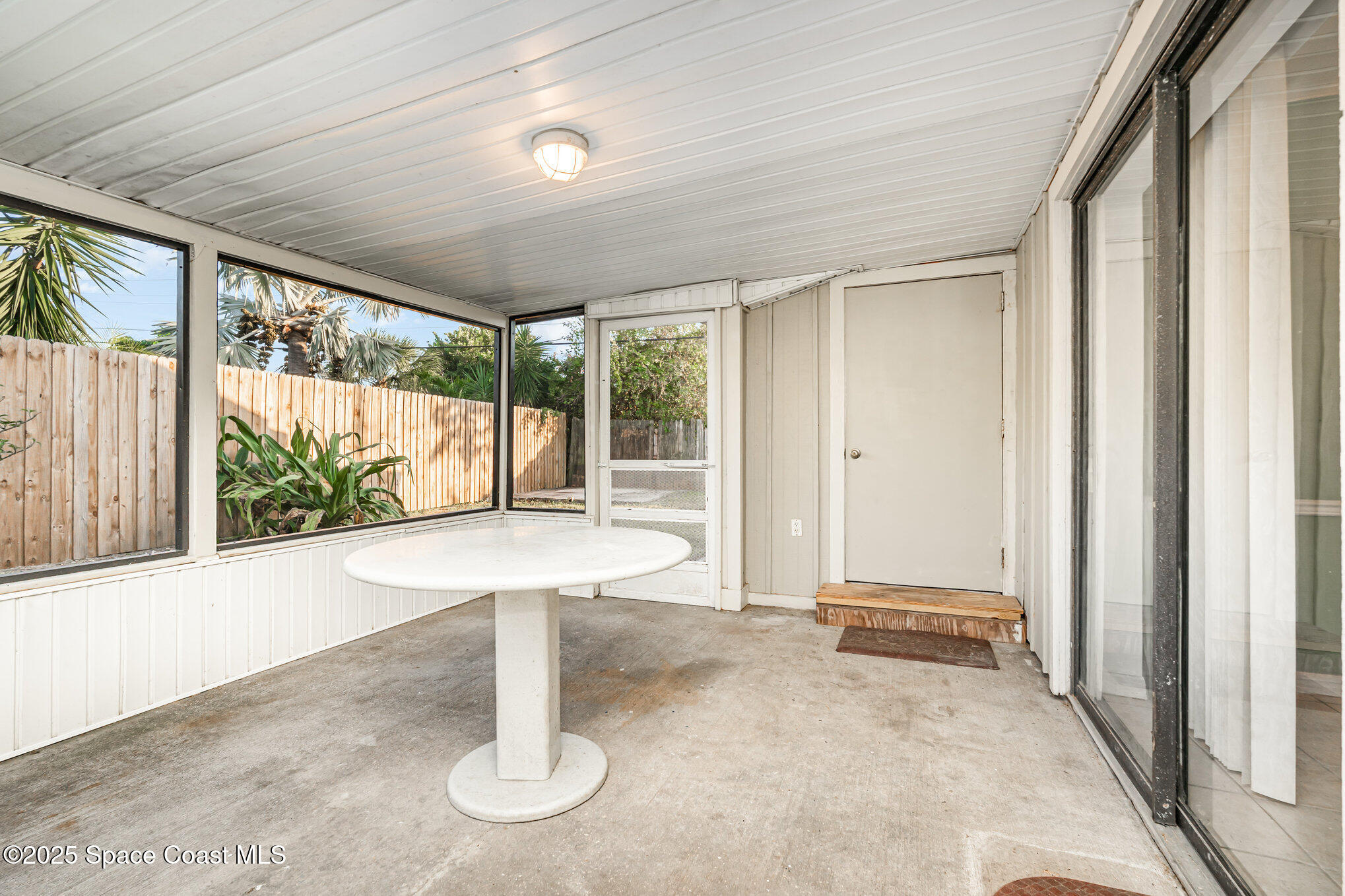 2155 Palm Avenue Indialantic, FL 32903 - Photo 14 of 15 a view of a room with wooden floor and outdoor space