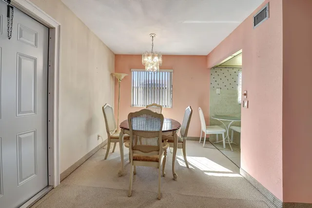 a kitchen with granite countertop a sink and wooden cabinets